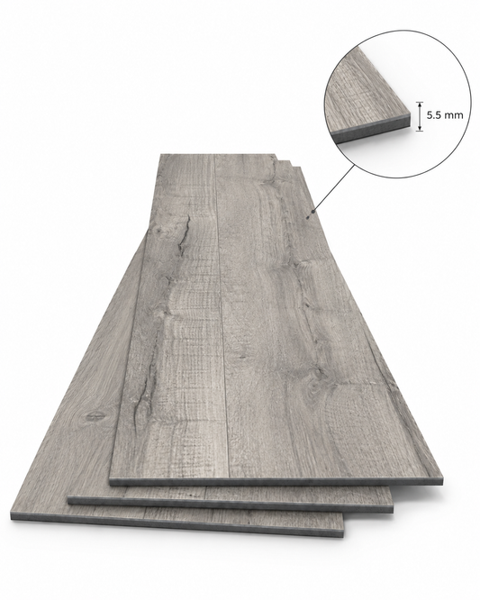 Gray wood-look laminate or vinyl plank flooring shown as a stack of rectangular boards on a white background, with a circular inset close-up highlighting a 5.5 mm edge thickness.